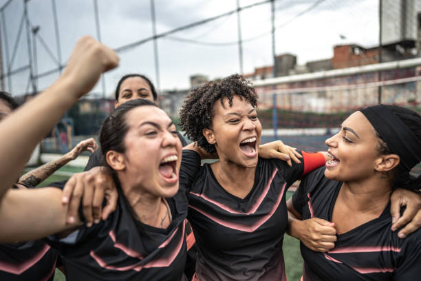 istock Happy female soccer team celebrating 1468593544