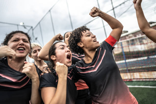 istock Happy female soccer team celebrating 1468593568