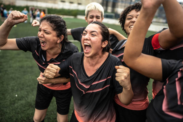 istock Happy female soccer team celebrating 1468593574