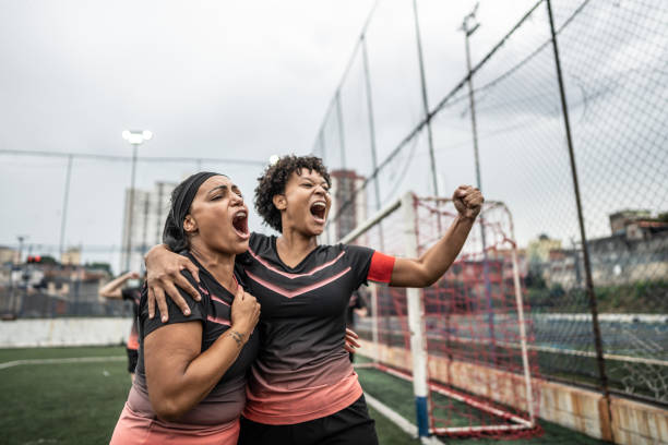 istock Happy female soccer team celebrating 1468593581