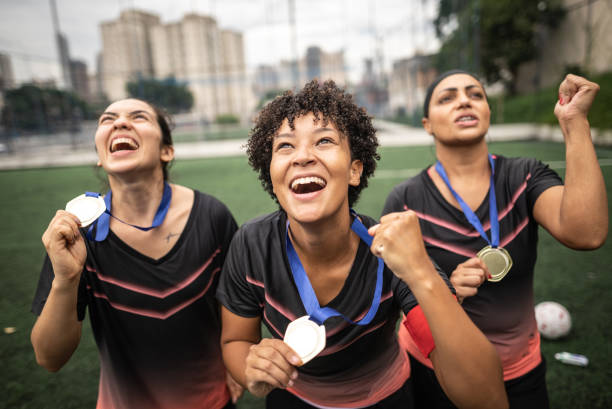 istock Female soccer team celebrating with medals 1468593608