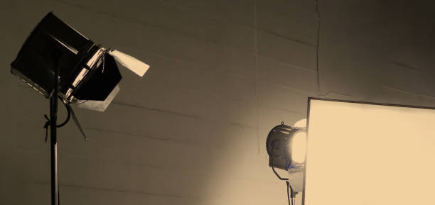istock Film light for video production camera in studio set. Use as studio photo shoot light. Big LED spot light 5000w and diffuser or black panel create light like sun light can make daytime or golden hour 1468593621