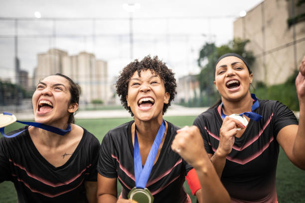 istock Female soccer team celebrating with medals 1468593624