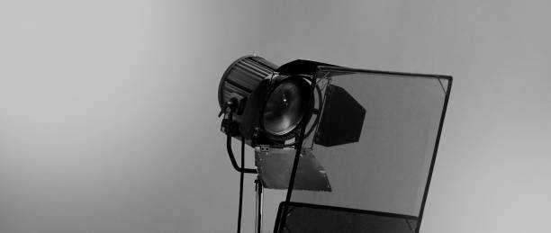 istock Film light for video production camera in studio set. Use as studio photo shoot light. Big LED spot light 5000w and diffuser or black panel create light like sun light can make daytime or golden hour 1468593649