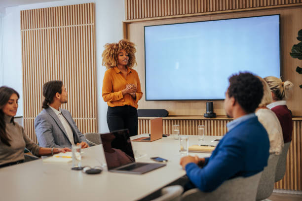 istock Female leader explaining strategy to team in meeting. 1468596166