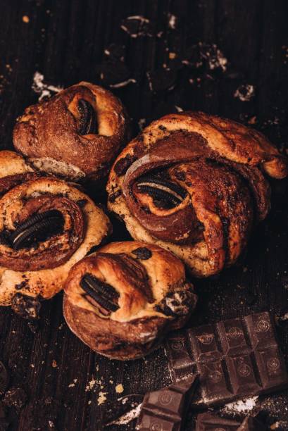 istock Chocolate pastries on a table, with crumbs and broken pieces scattered around the surface 1468597649