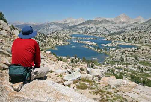 Man admiring Marie lake. Sierra Nevada mountains, California.