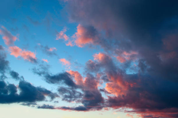 istock Heavenly landscape with pink clouds on purple sky during sunset. 1468599801