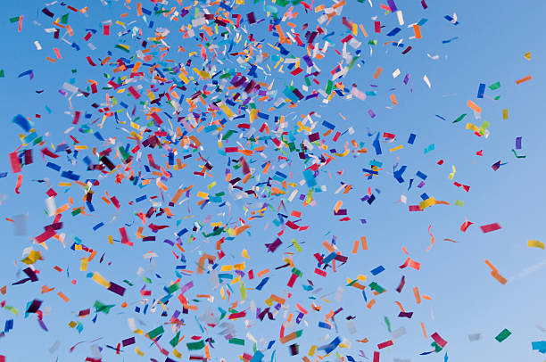 istock Confetti paper filled colorful blue sky background 146860107