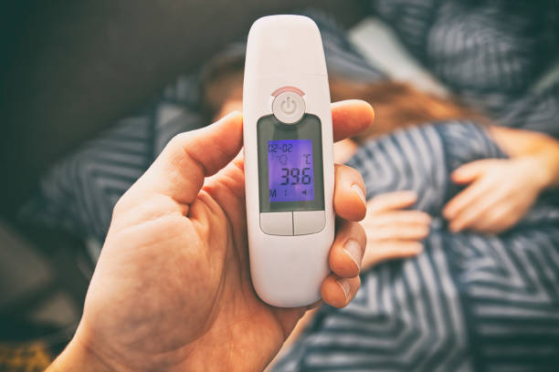 istock A thermometer in a man's hand that shows high temperature in his wife 1468601228