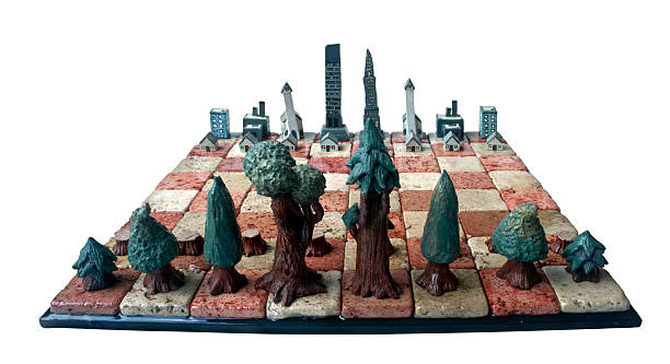 Clay Chess Set: Forest vs. City stock photo