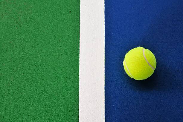 istock Tennis ball just on the line 146860330