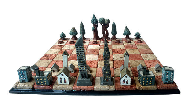 Clay Chess Set: City vs. Forest stock photo