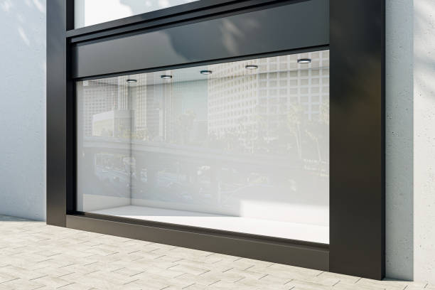 istock Perspective view on blank light wall background in empty shop window with space for your product presentation behind glass walls with city reflection in modern building outdoors. 3D rendering, mockup 1468606580