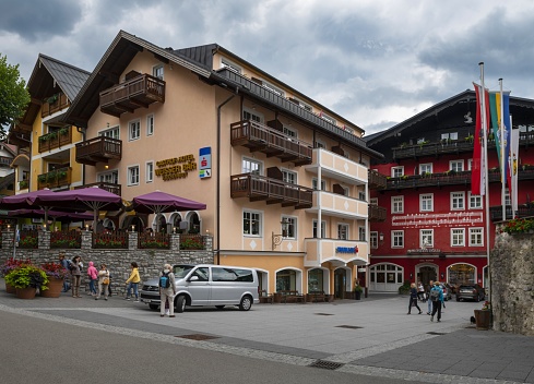 Sankt Wolfgang im Salzkammergut, Austria, July 10, 2022: View of a street in this small town in Upper Austria on a cloudy summer day. The region is also known as Salzkammergut, part of which is listed as UNESCO World Heritage Site.