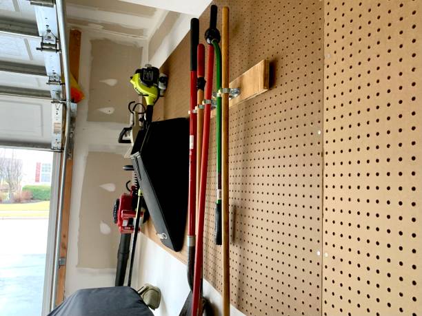 istock Lawn Equipment Hanging on Pegboard 1468611559