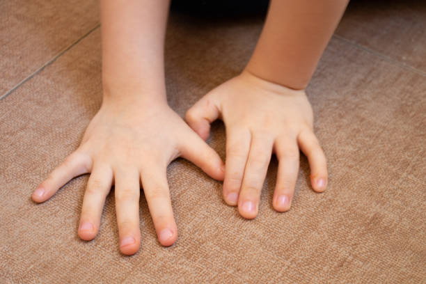 istock children's small palm close-up on a brown tile top view 1468611897