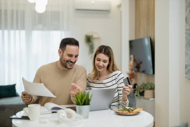 istock Young married couple working from home office 1468612435