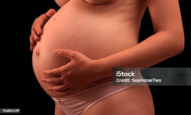 Pregnant Woman Holding Stomach Stock Photo - Download Image Now - Abdomen, Adult, Adults Only