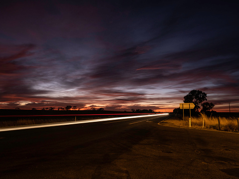 Sunrise on country road and moving car, The Wimmera Victoria