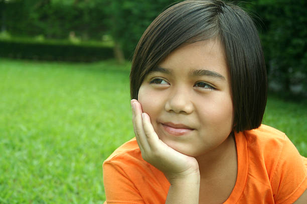 Eight years old long hair girl posing outdoors