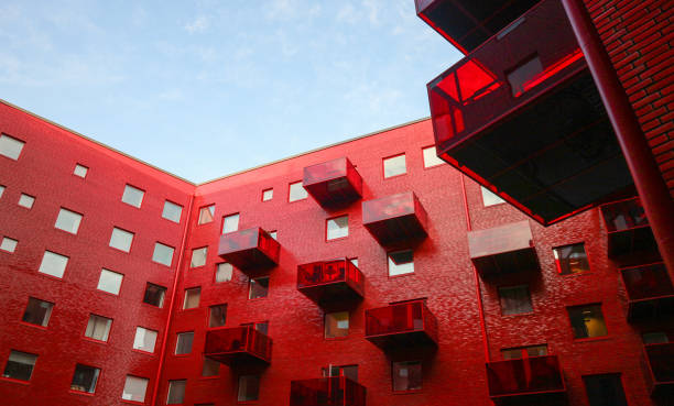 istock Low angle view of red modern building against sky 1468624247