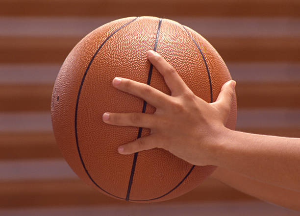 istock Hands Holding a Basketball 146862711