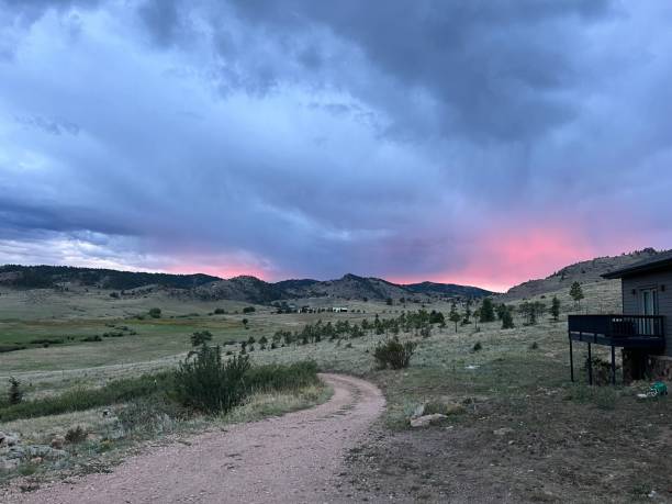 istock Sunset Mountain View with a Dirt Road 1468627177