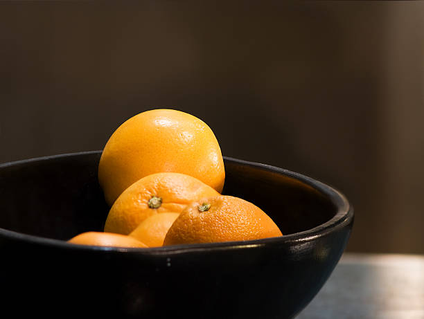 istock Oranges into black Japanese-style vase 146862900