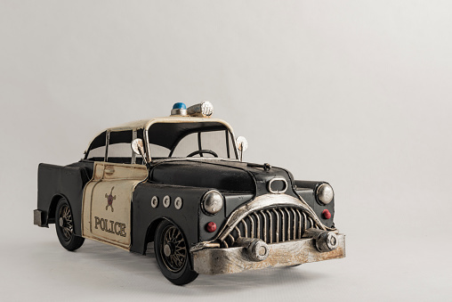 photograph of an old metal police car for decoration vintage iron collection