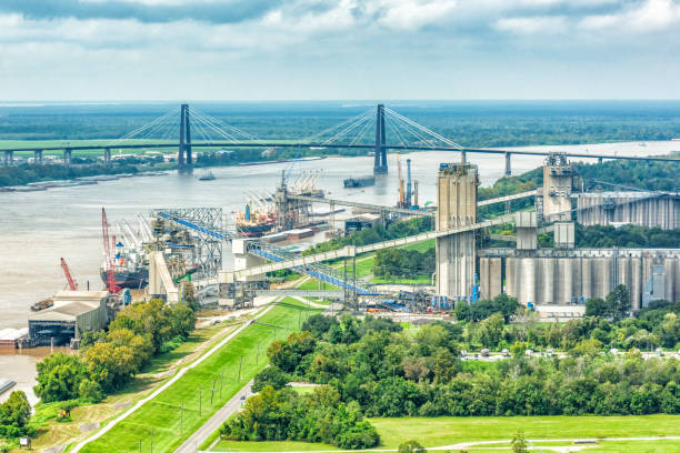 A large grain export facility on the banks of the Mississippi River near New Orleans loading a ship ready for export internationally.