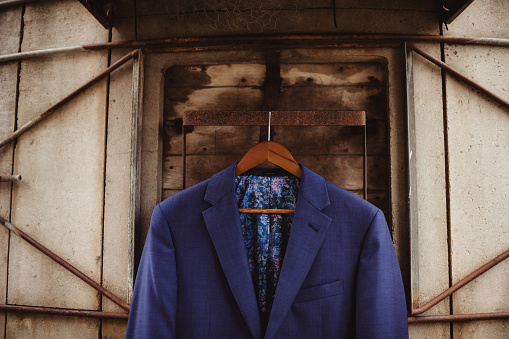 Men's tweed sport coats with scarves in the clothing store