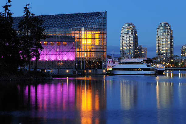 False creek night scene with glass building, vancouver
