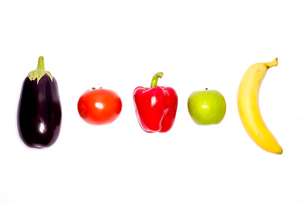 Line up of fresh fruit and veg stock photo