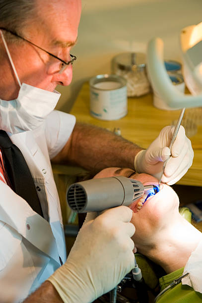 Dentist working stock photo