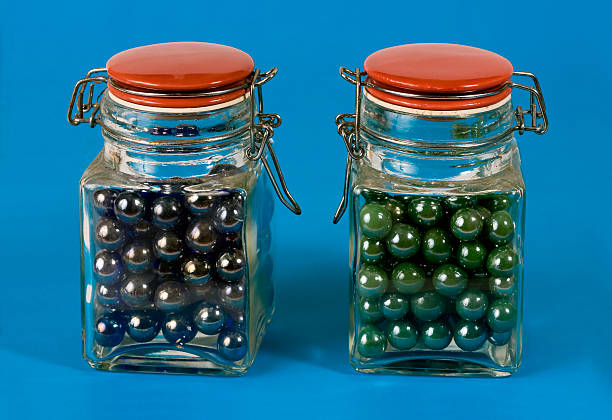 Two glass jars with red lids stock photo