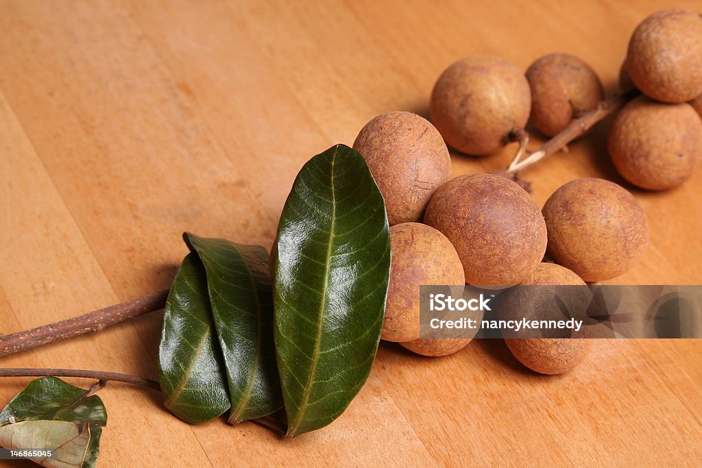 Longan Fruit Longan, native to southern China, taste similar to lychee. Asian and Indian Ethnicities Stock Photo