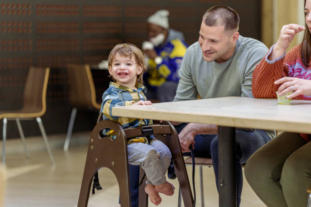 istock Happy toddler at a restaurant with his parents 1468654424