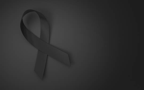 istock Awareness black strip folded, sitting on the black floor 1468654510