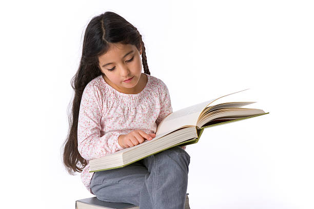 istock Little girl studying a large book 146865470