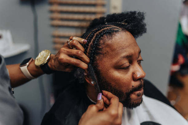 istock Man having hair braided in barber shop 1468654889