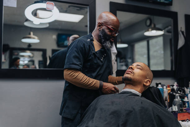 istock Man having his head shaved in barber shop 1468654913