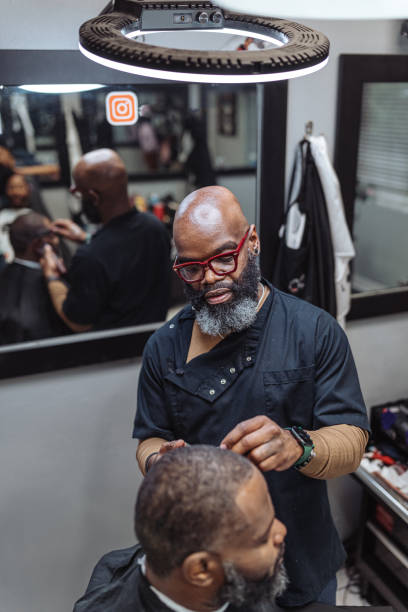 istock Black man working in barber shop 1468655009
