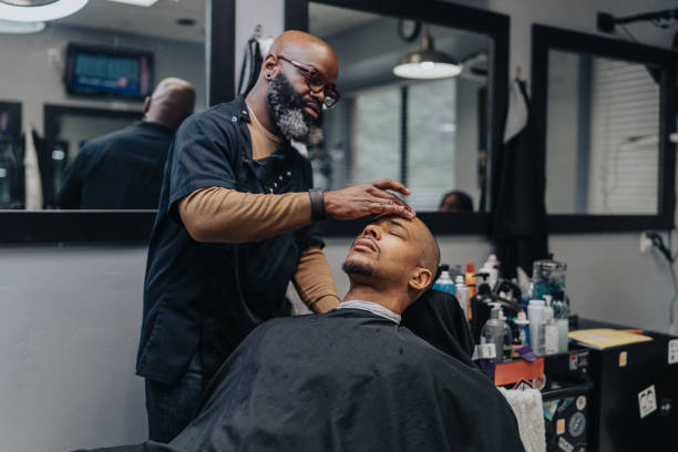 istock Man having his head shaved in barber shop 1468655124
