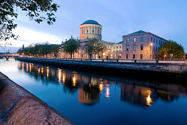 Four Courts and River Liffey The Four Courts and River Liffey in Dublin in the evening. dublin republic of ireland photos stock pictures, royalty-free photos & images