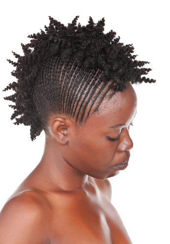 hairstyle of young girl with traditional african braids,