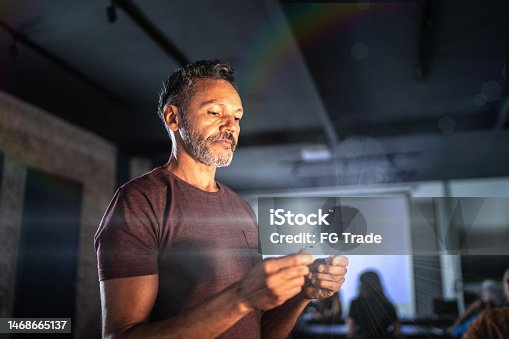 istock Mature man using an augmented reality device 1468665137