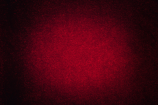 Abstract dark red background with spot lighting for copy space.