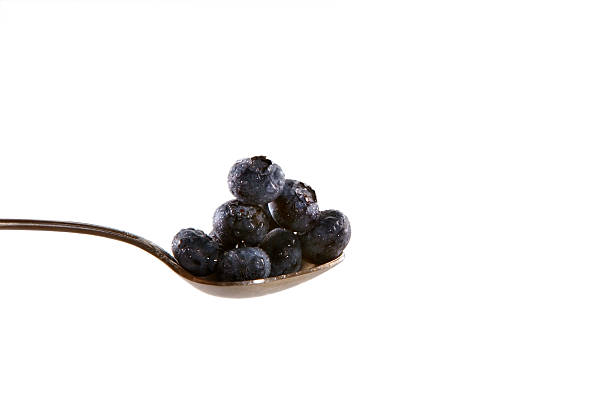 Blueberries on spoon stock photo