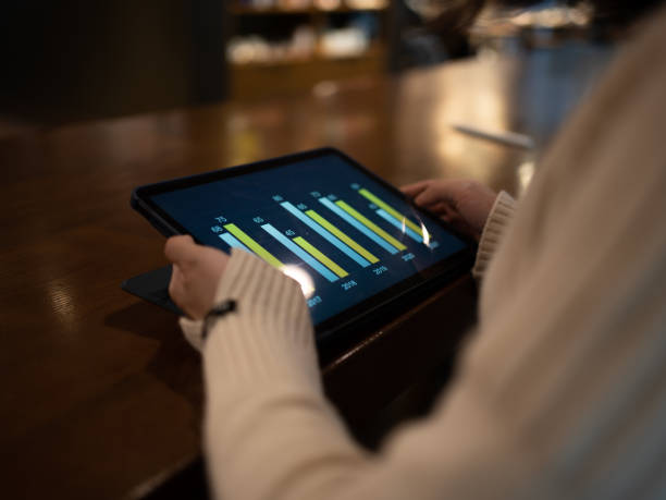 istock Close-up of looking at data charts with tablet 1468667545